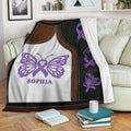 Fibromyalgia awareness throw blanket displayed on a sofa with purple butterfly artwork