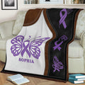 Close view of a purple Fibromyalgia awareness blanket with butterfly and ribbon symbols