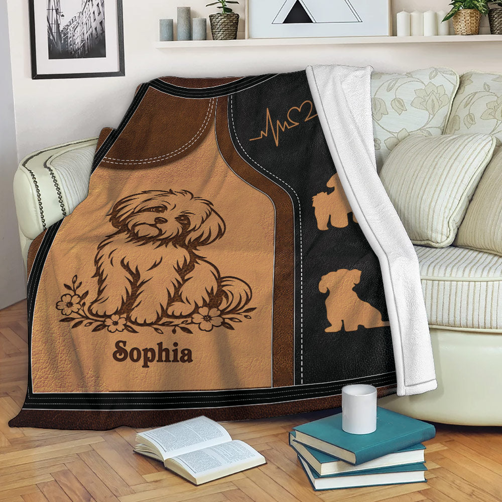 Maltese dog throw blanket displayed on a sofa with warm brown and black artwork