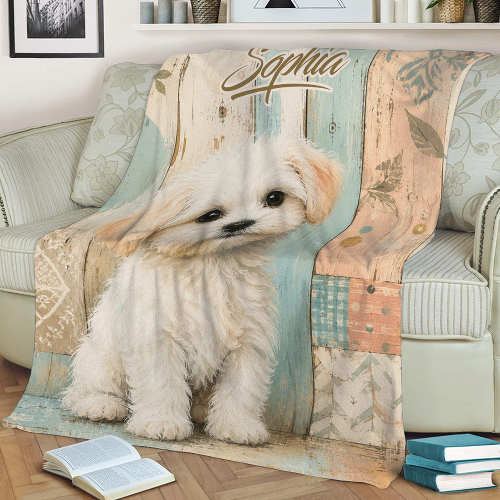 Maltese dog throw blanket displayed on a sofa with soft pastel wood and floral details