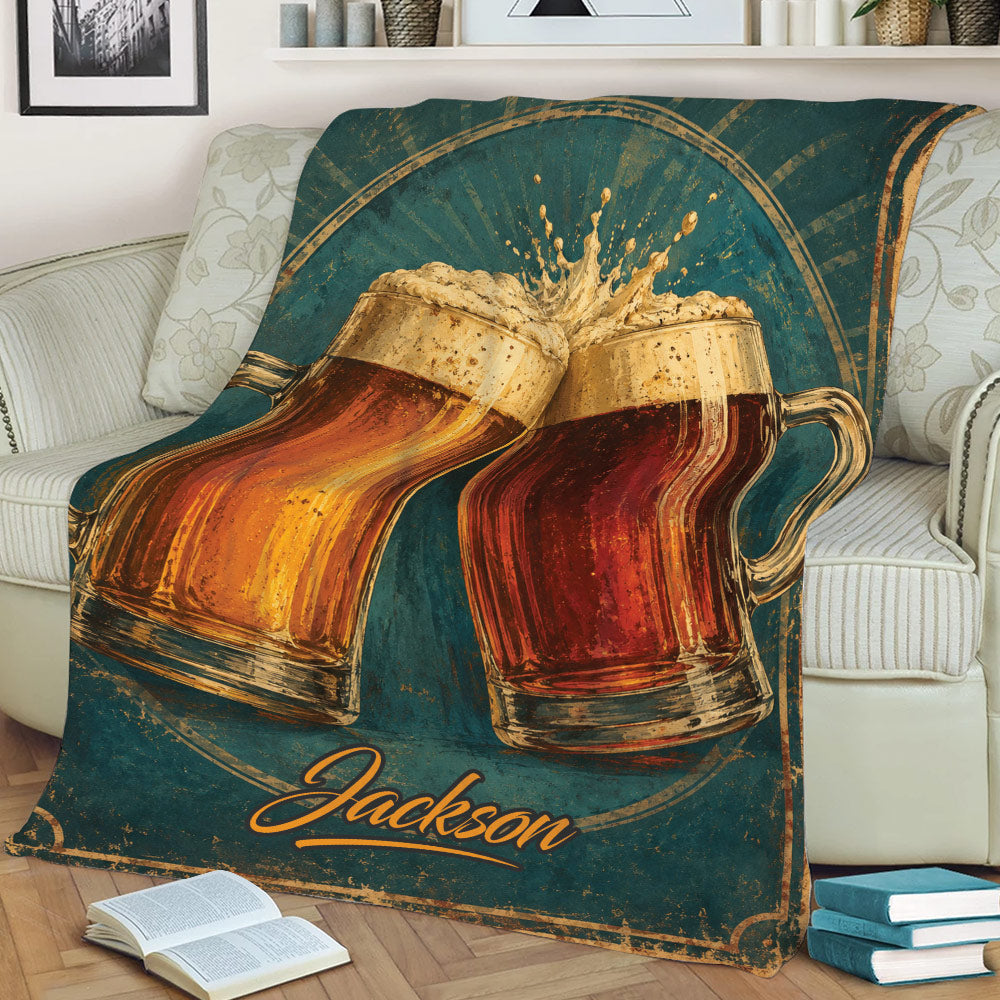 Close view of a cozy beer blanket on a couch with illustrated amber beer mugs