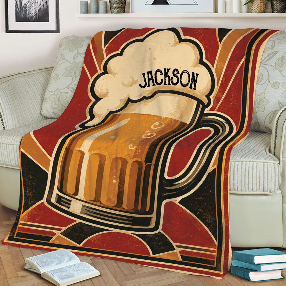 Retro beer mug blanket draped over a sofa with warm vintage colors