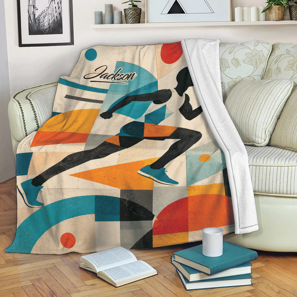 Running throw blanket displayed on a sofa with colorful geometric runner artwork