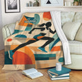 Running blanket draped over a sofa with colorful geometric shapes and an athletic runner design