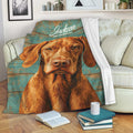 Vizsla dog blanket displayed on a sofa with rustic wood-look artwork and cozy living room decor