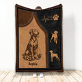 Vizsla dog blanket with brown and black artwork, paw print motif, floral detail, and stitched border