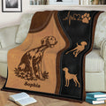 Close view of Vizsla dog artwork on a brown and black throw blanket with paw and heartbeat motifs