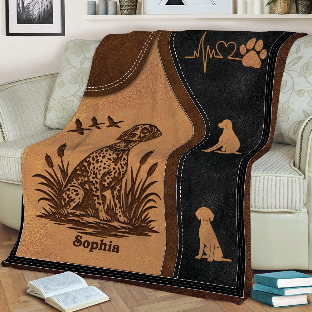 Close view of German Shorthaired Pointer throw blanket featuring spotted dog artwork, cattails, and dog silhouettes