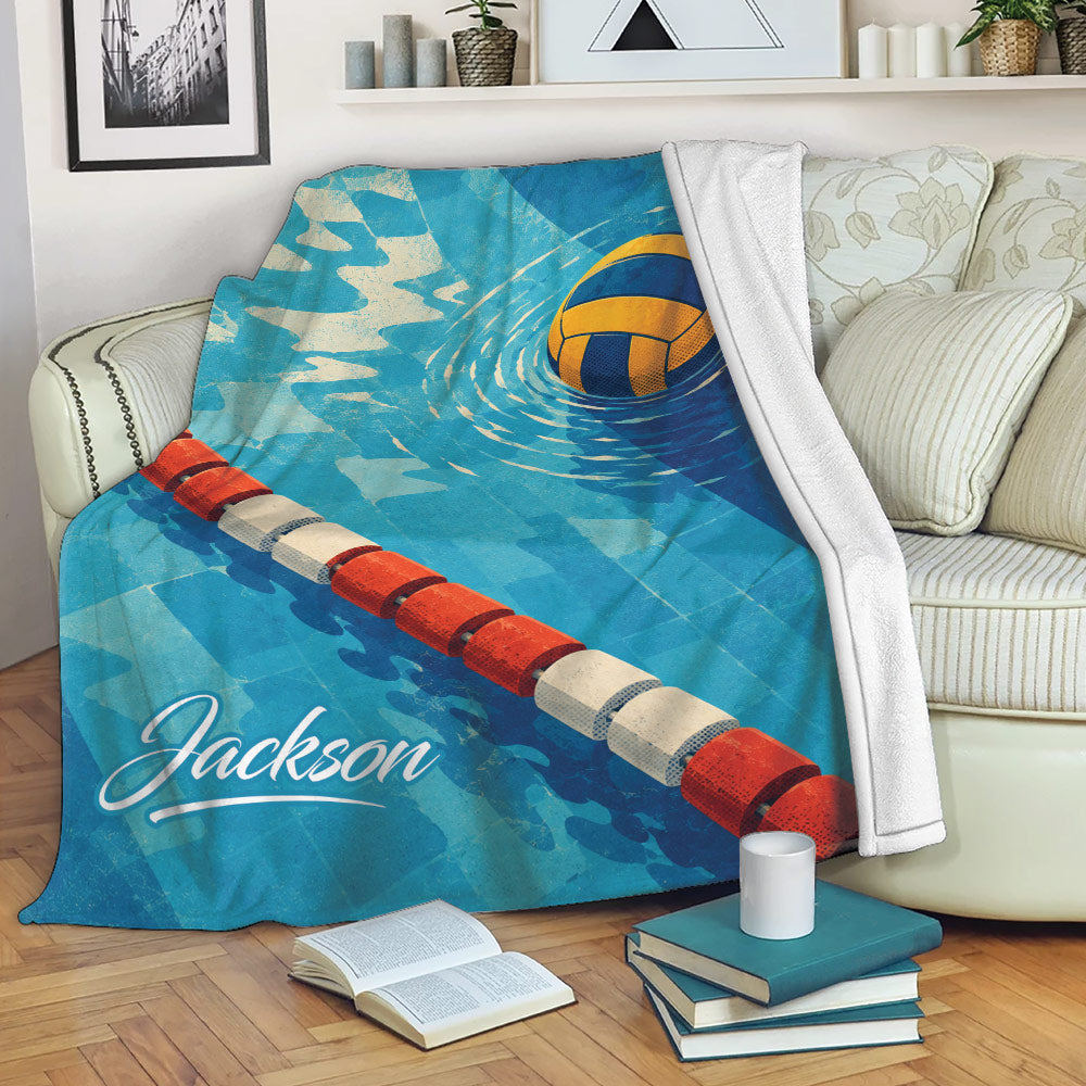 Water polo throw blanket draped over a sofa with blue pool artwork and floating ball design