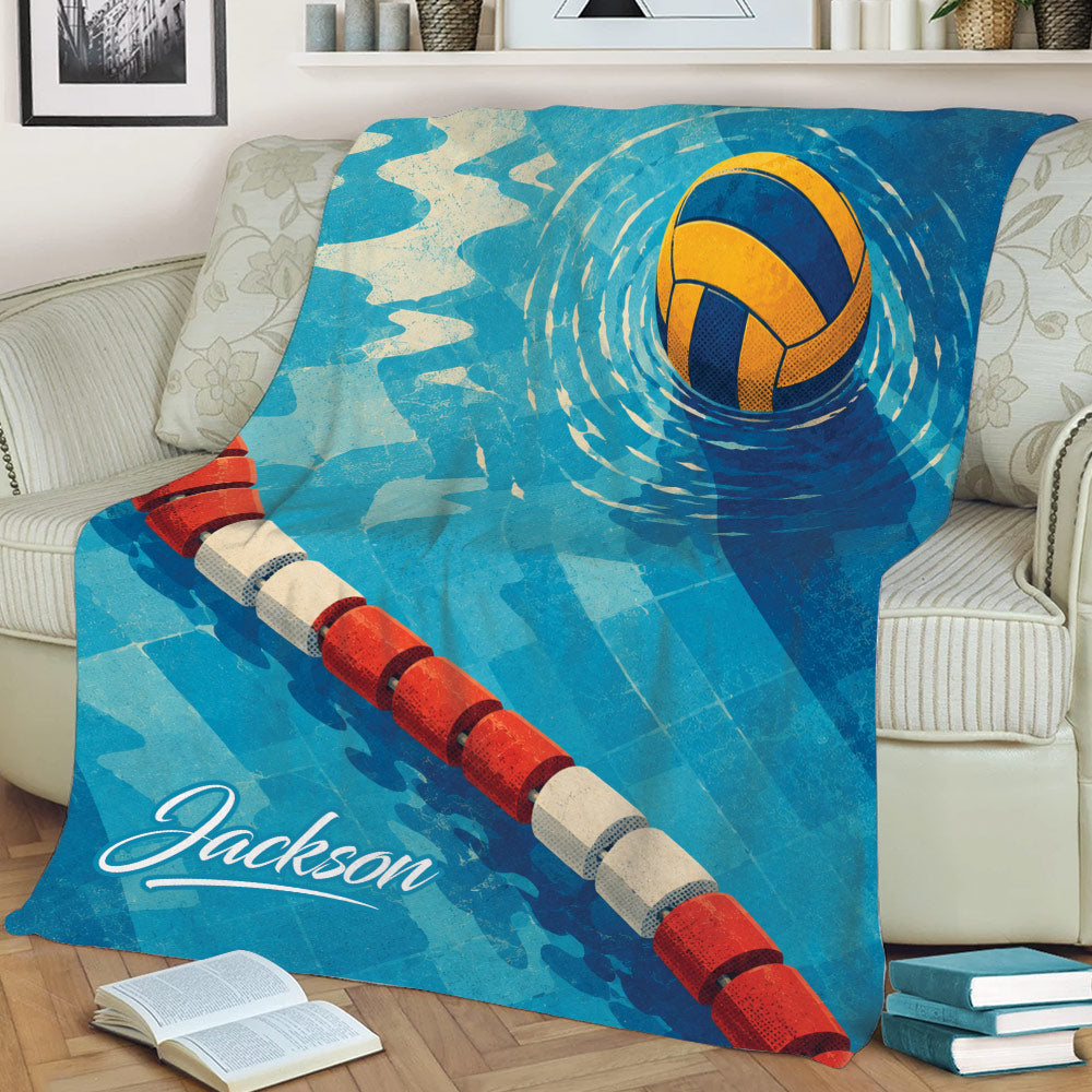 Blue water polo blanket styled on a sofa with a floating ball and red and white lane rope