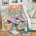 Roller skating throw blanket draped over a sofa with purple quad skates and pastel star graphics