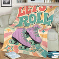 Close view of a colorful roller skating blanket featuring purple quad skates and retro artwork
