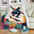 Skateboarding throw blanket displayed on a sofa with bold geometric colors and urban artwork