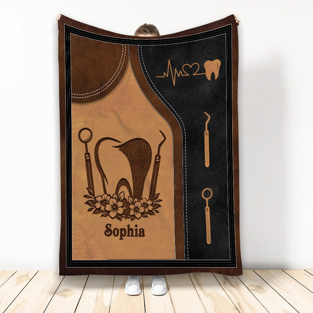 Dental Hygienist blanket with tooth, dental tools, floral accents, and brown and black artwork