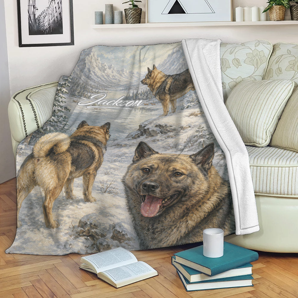 Norwegian Elkhound blanket draped over a sofa with snowy mountain dog artwork