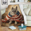 Norwegian Elkhound throw blanket displayed on a sofa with patriotic dog artwork