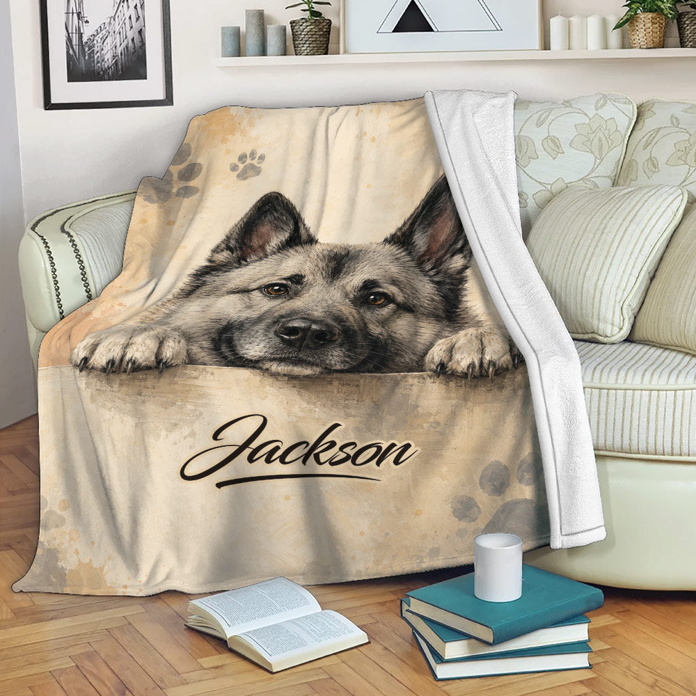 Norwegian Elkhound blanket draped over a sofa in a cozy living room setting