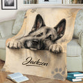 Rustic Norwegian Elkhound throw blanket displayed on a sofa with paw print artwork