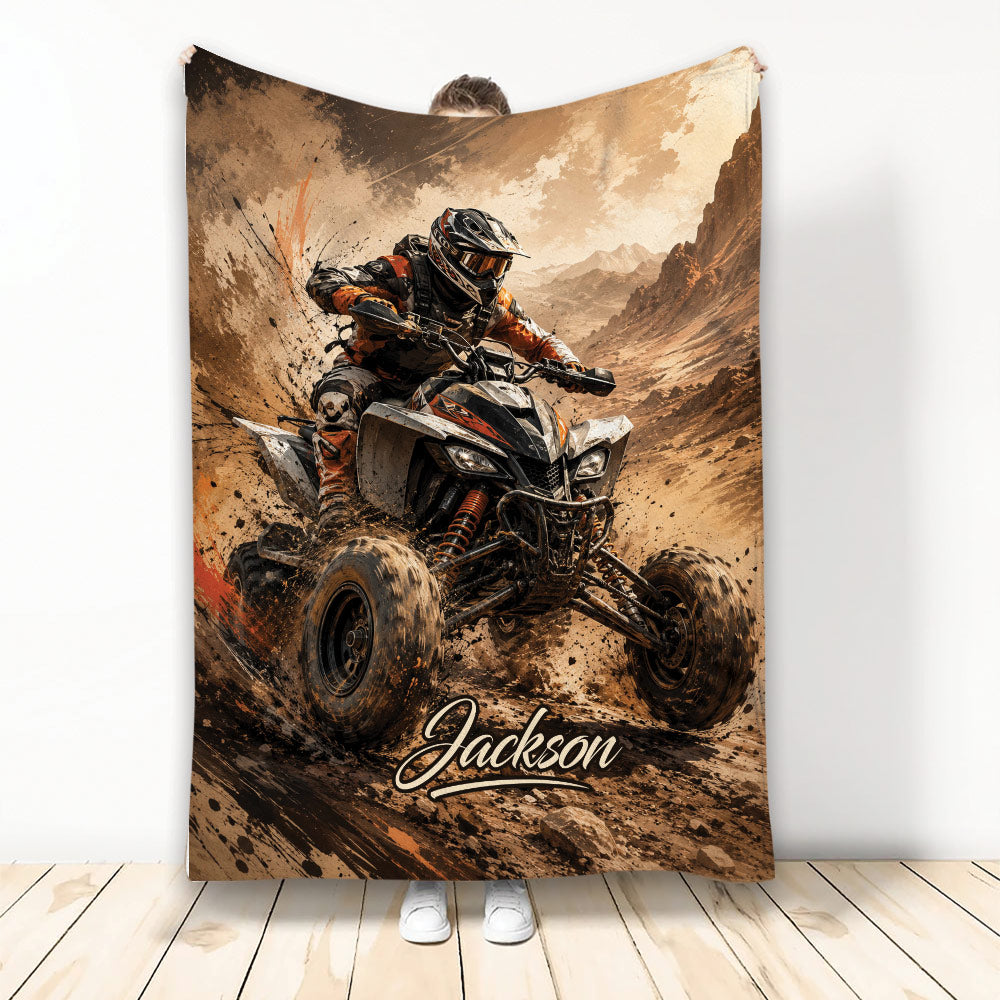 ATV throw blanket featuring a helmeted off-road rider racing through a rugged mountain landscape