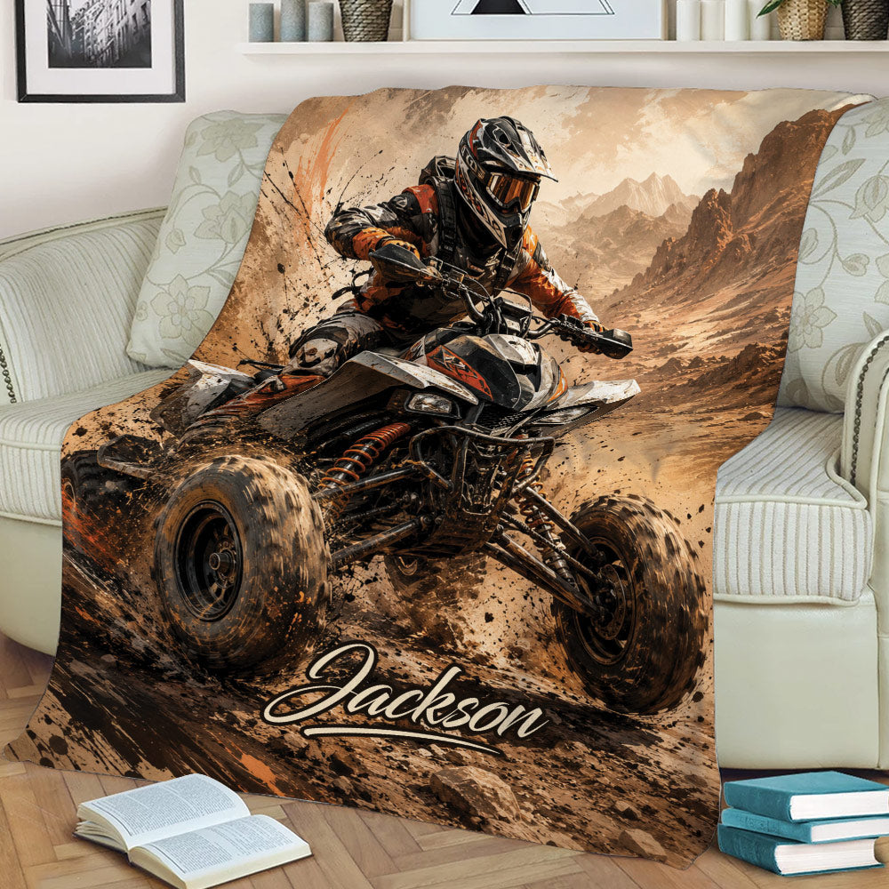 ATV throw blanket draped over a couch, featuring dramatic quad racing artwork in earthy tones