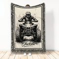 Black and cream ATV throw blanket featuring an off-road quad rider and rugged tire-track border