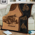 Close view of an ATV blanket featuring multiple quad bike riders in a bold rustic design