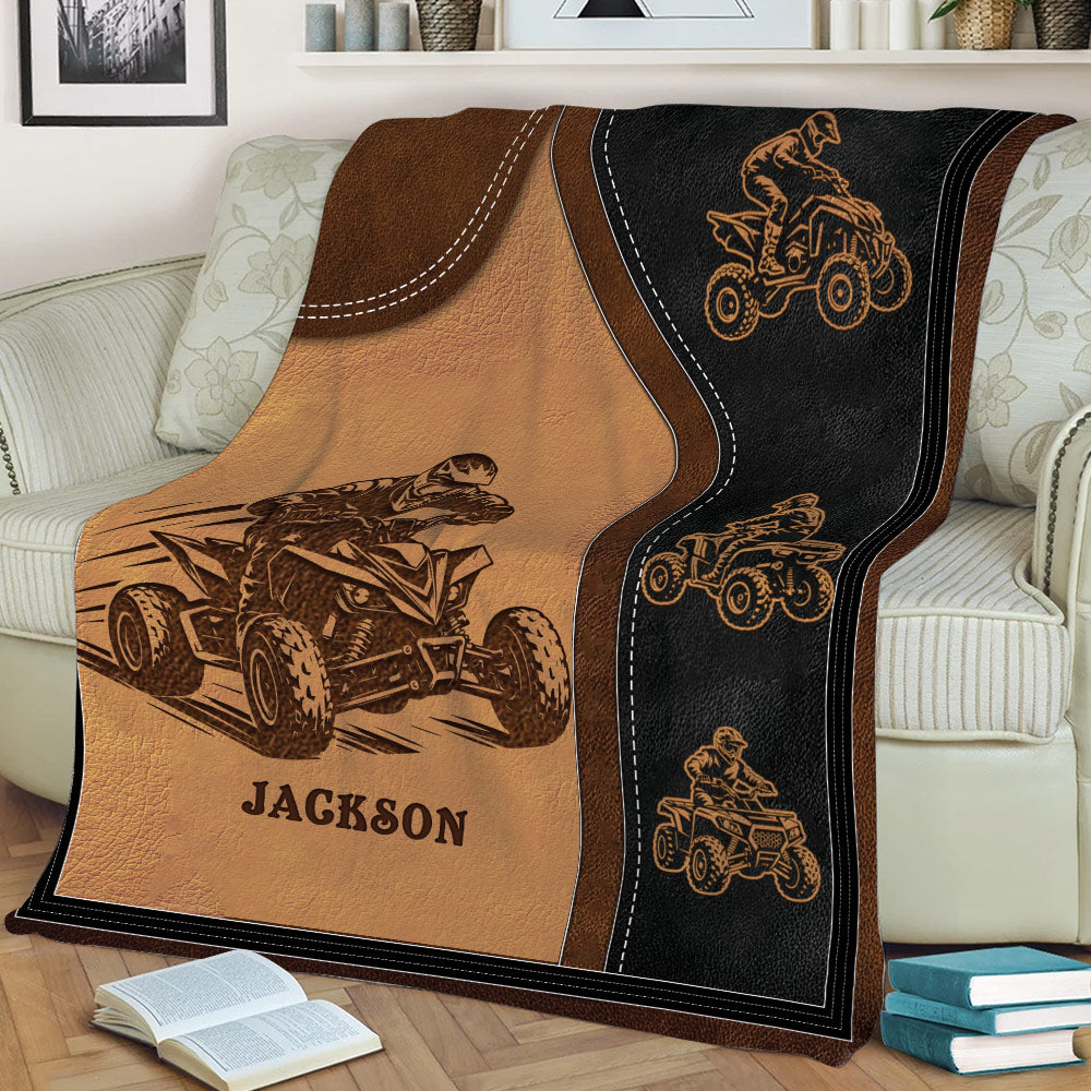 Close view of an ATV blanket featuring multiple quad bike riders in a bold rustic design