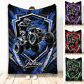 Custom ATV throw blanket featuring an off-road quad rider in bold blue, purple, red, and green designs