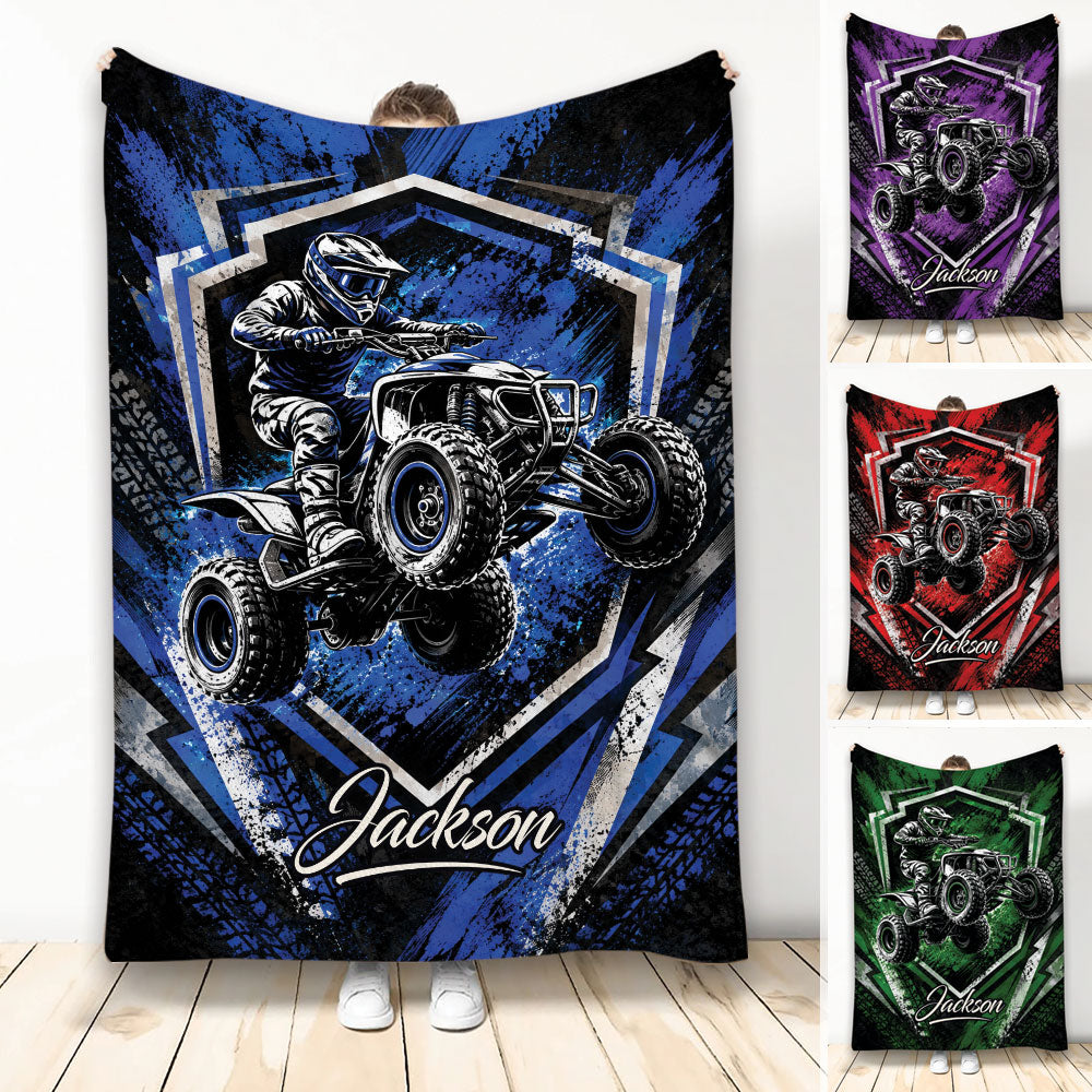 Custom ATV throw blanket featuring an off-road quad rider in bold blue, purple, red, and green designs