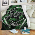 Green ATV throw blanket displayed on a sofa with an off-road quad rider and rugged graphic artwork