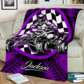 Purple ATV throw blanket styled on a sofa with dramatic quad artwork and racing-inspired checkered flag graphics