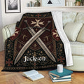 Knights Templar throw blanket draped over a sofa with crossed swords and dark medieval heraldic design