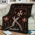 Close lifestyle view of a Knights Templar blanket featuring crossed swords, shields, and ornate red and black artwork