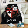 Knights Templar throw blanket displayed on a sofa with medieval shield and ornate red and black design