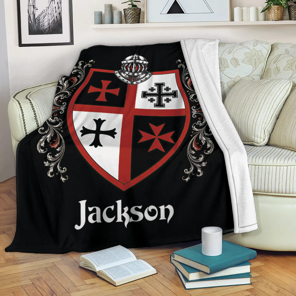 Knights Templar throw blanket displayed on a sofa with medieval shield and ornate red and black design