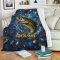 Fishing throw blanket draped over a sofa with a large fish, tackle artwork, and blue water-inspired design