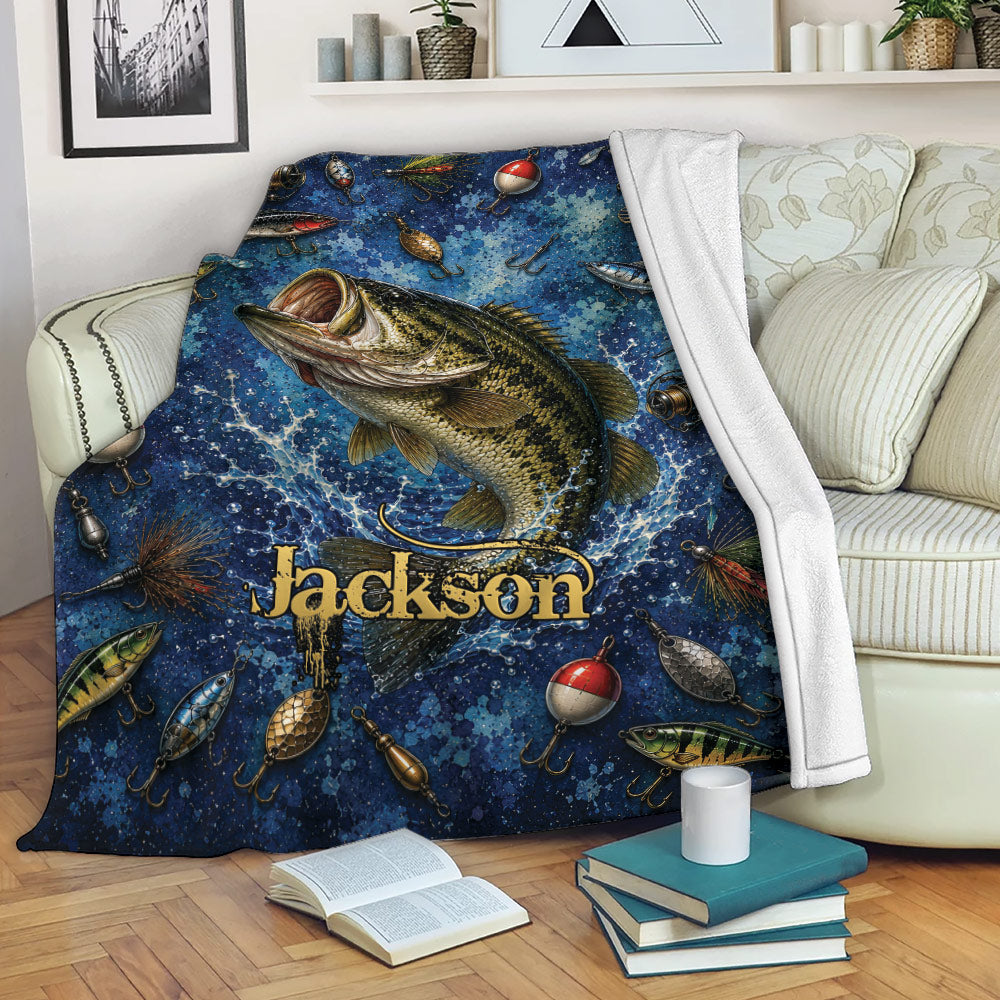 Fishing throw blanket draped over a sofa with a large fish, tackle artwork, and blue water-inspired design