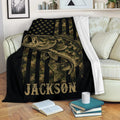 Fishing blanket draped over a sofa, featuring a large fish and dark camouflage outdoor design