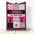 Cheerleading throw blanket with pink and black cheerleader silhouettes, pom-poms, stars, and megaphones