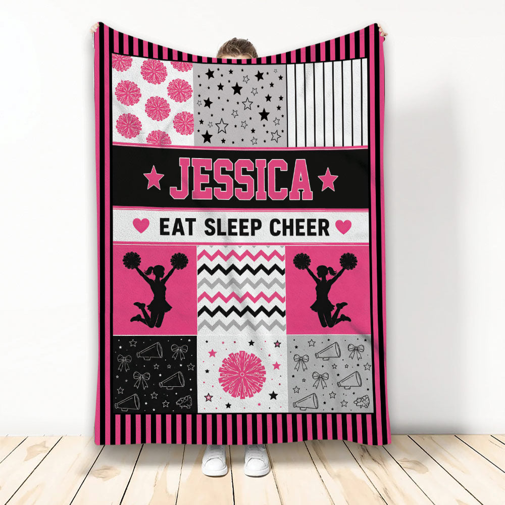 Cheerleading throw blanket with pink and black cheerleader silhouettes, pom-poms, stars, and megaphones