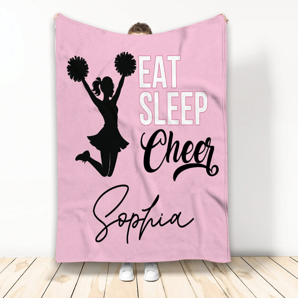 Pink cheerleading throw blanket with cheerleader silhouette, pom-poms, and bold sports artwork