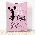 Pink cheerleading throw blanket with cheerleader silhouette, pom-poms, and bold sports artwork