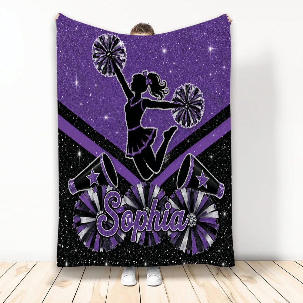 Purple cheerleading blanket with a cheerleader silhouette, pom-poms, megaphones, and sparkling star accents
