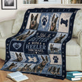 Australian Cattle Dog throw blanket draped over a couch, featuring multiple Heeler portraits and blue tones