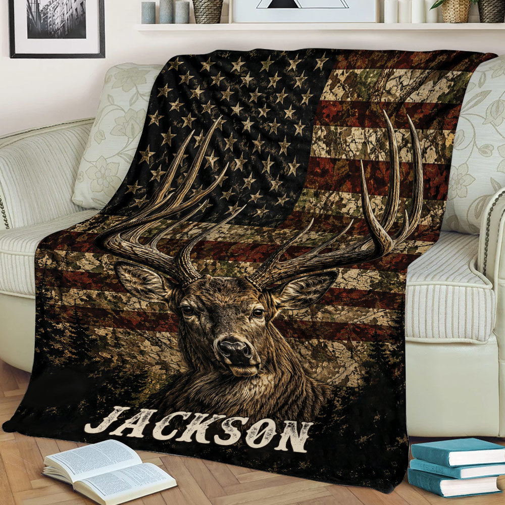 Antlered deer throw blanket displayed on a sofa with distressed patriotic wildlife artwork