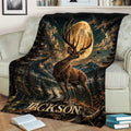 Rustic deer throw blanket draped over a couch with dramatic stag and moonlit wilderness artwork
