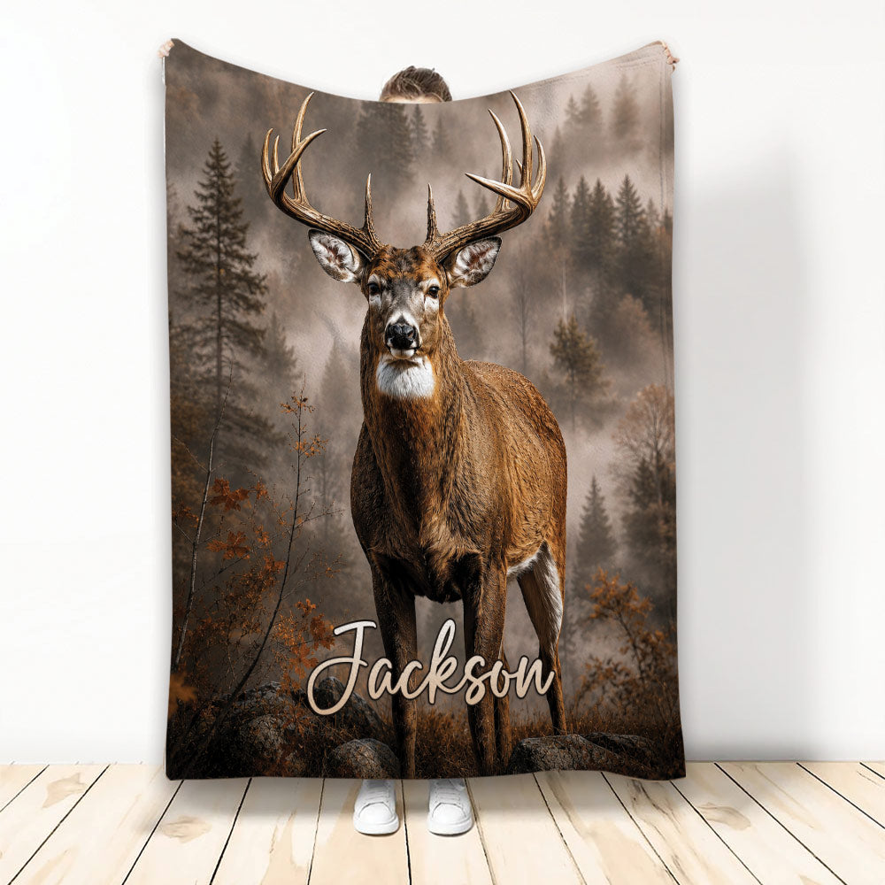 Deer throw blanket featuring a realistic buck in a misty evergreen forest with autumn foliage