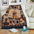 Poodle throw blanket displayed on a sofa with patriotic dog artwork, stars, stripes, and a cozy living room setting