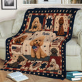 Patriotic poodle throw blanket draped over a sofa, featuring curly-coated dogs, stars, stripes, and decorative panels