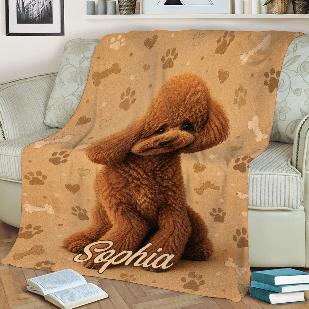 Poodle throw blanket draped over a couch with a curly brown dog and paw print artwork